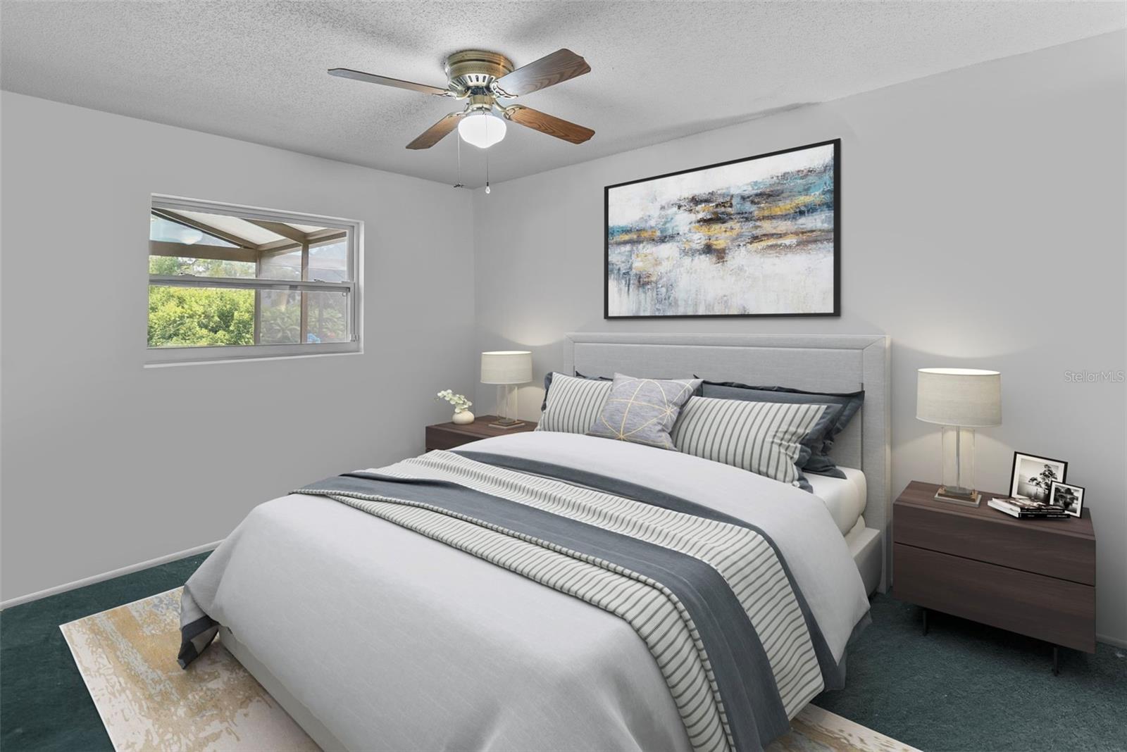 Well-sized guest bedroom with ample closet space and natural light.