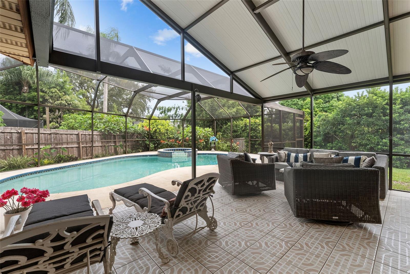 Expansive covered lanai with outdoor bar area — the ultimate spot for entertaining.