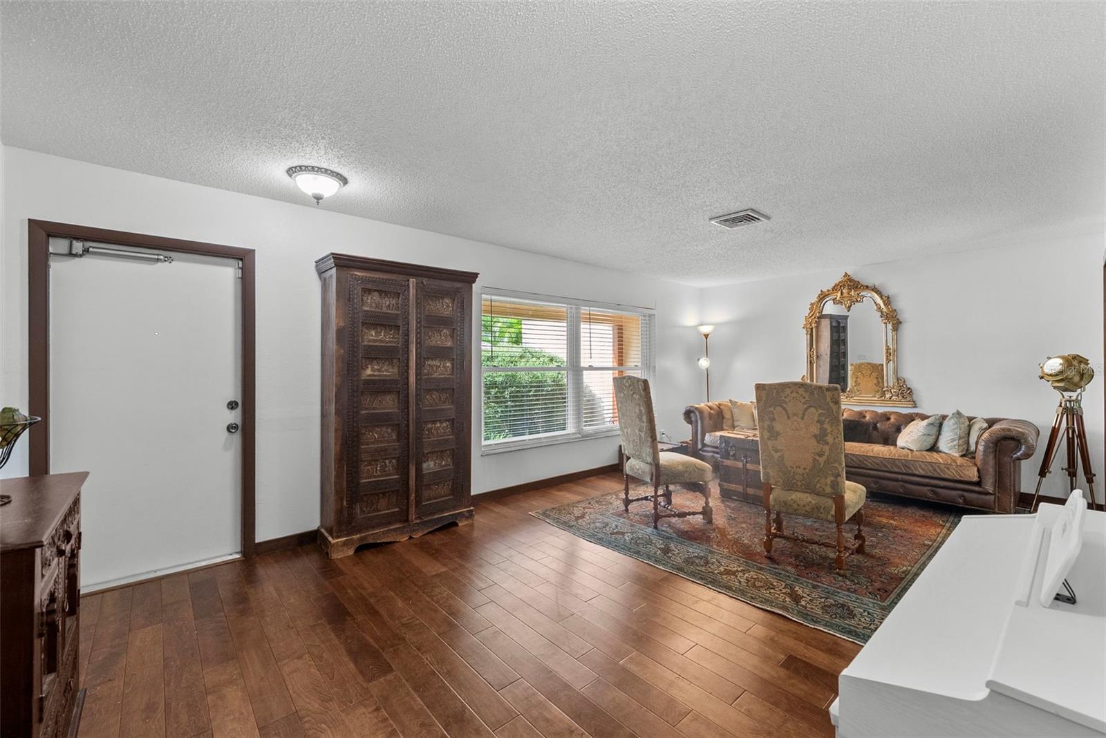 Another view of foyer and living room
