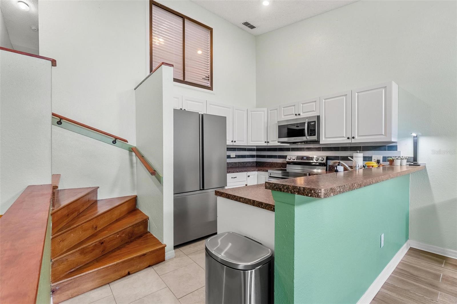 Kitchen- Stairs leading to 2nd floor
