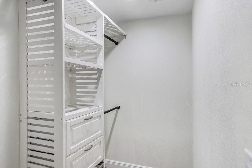 Walk In "His and Hers" Closets with Built Ins