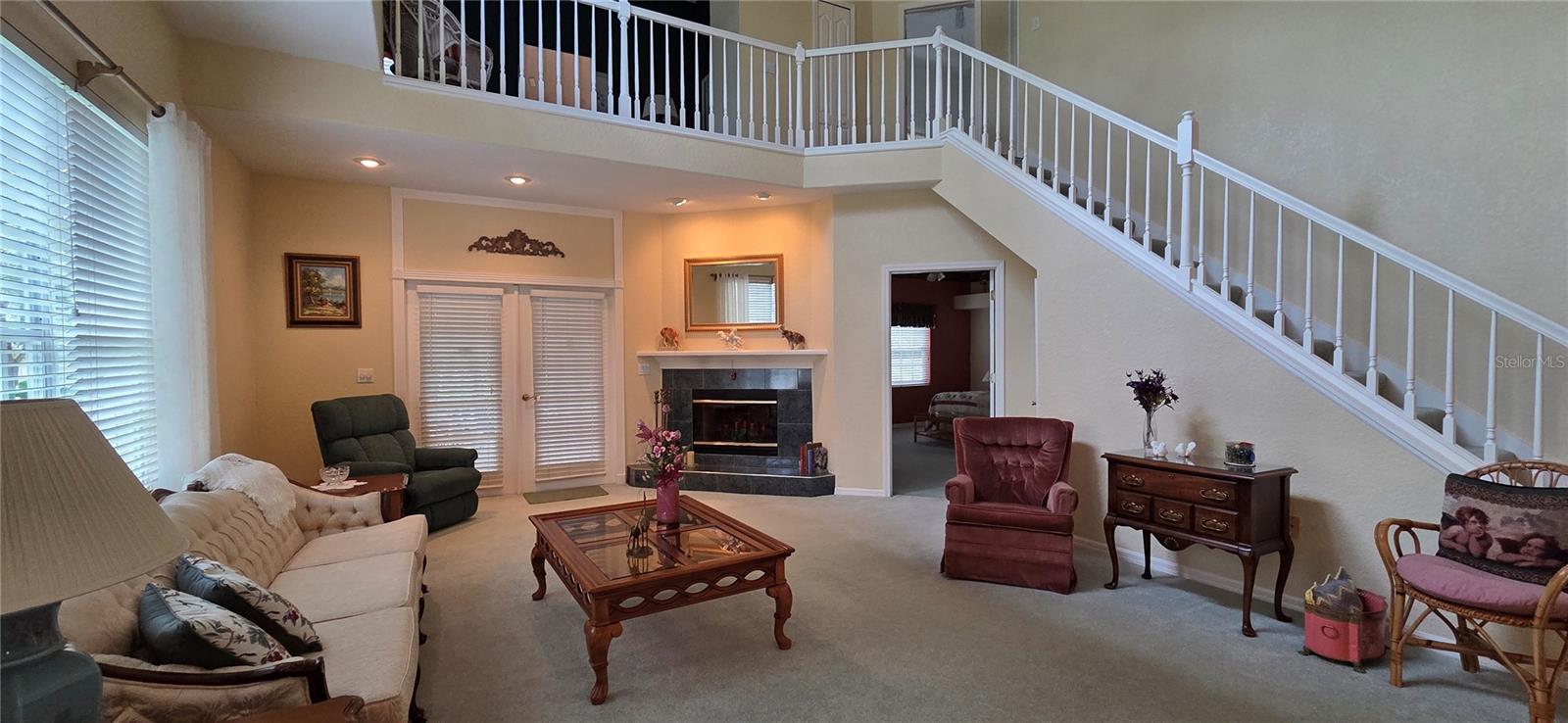 Living room with wood burning fireplace