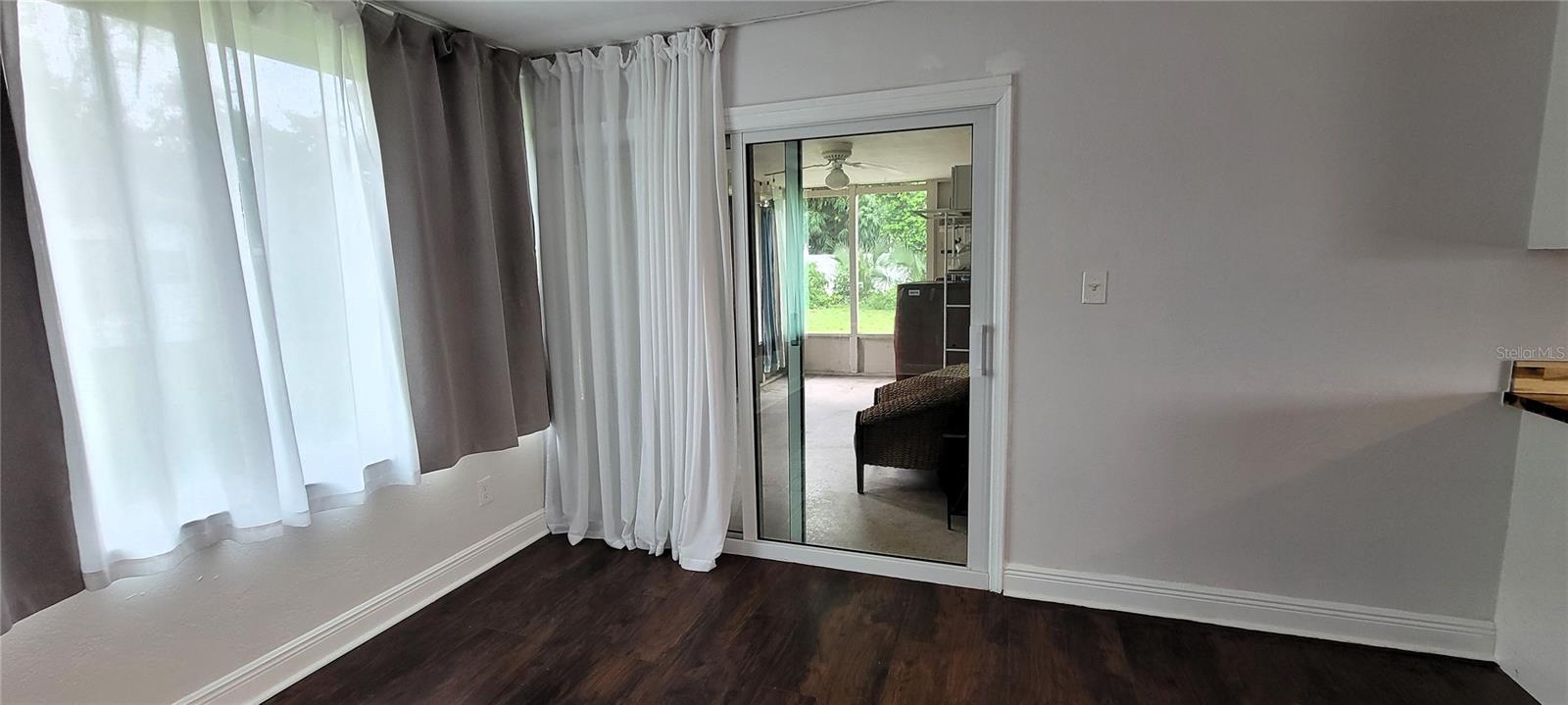 Rear Porch Access (hurricane sliding glass doors)