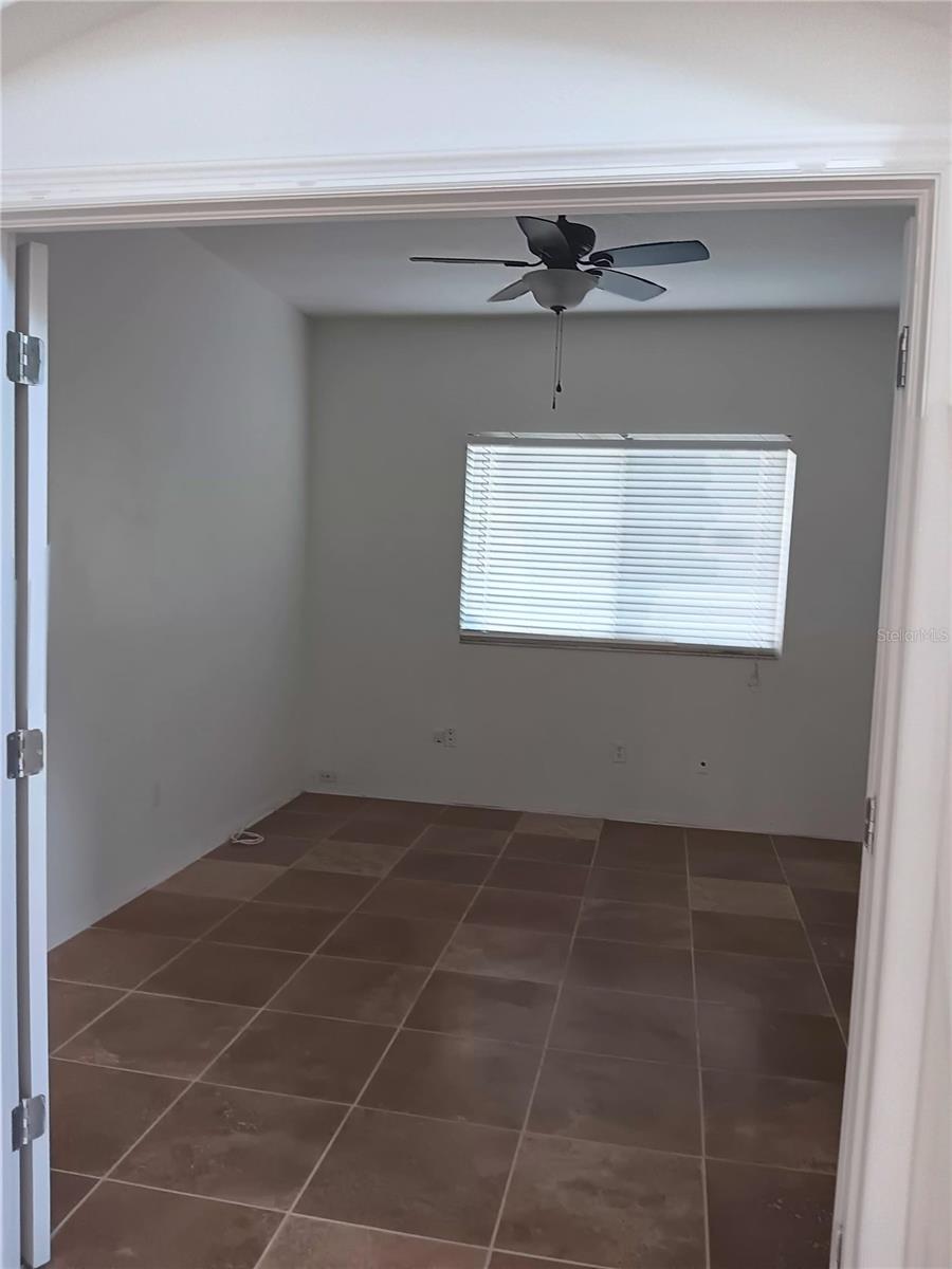 den with expensive travertine tiles