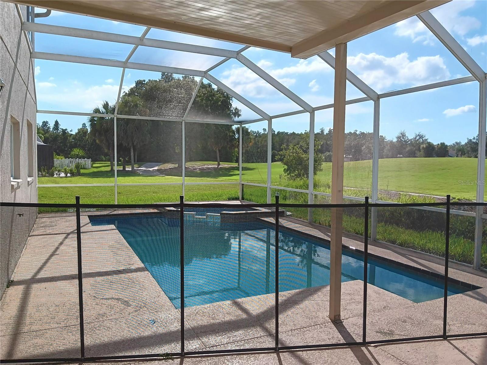 Lanai pool and spa with child safety fence