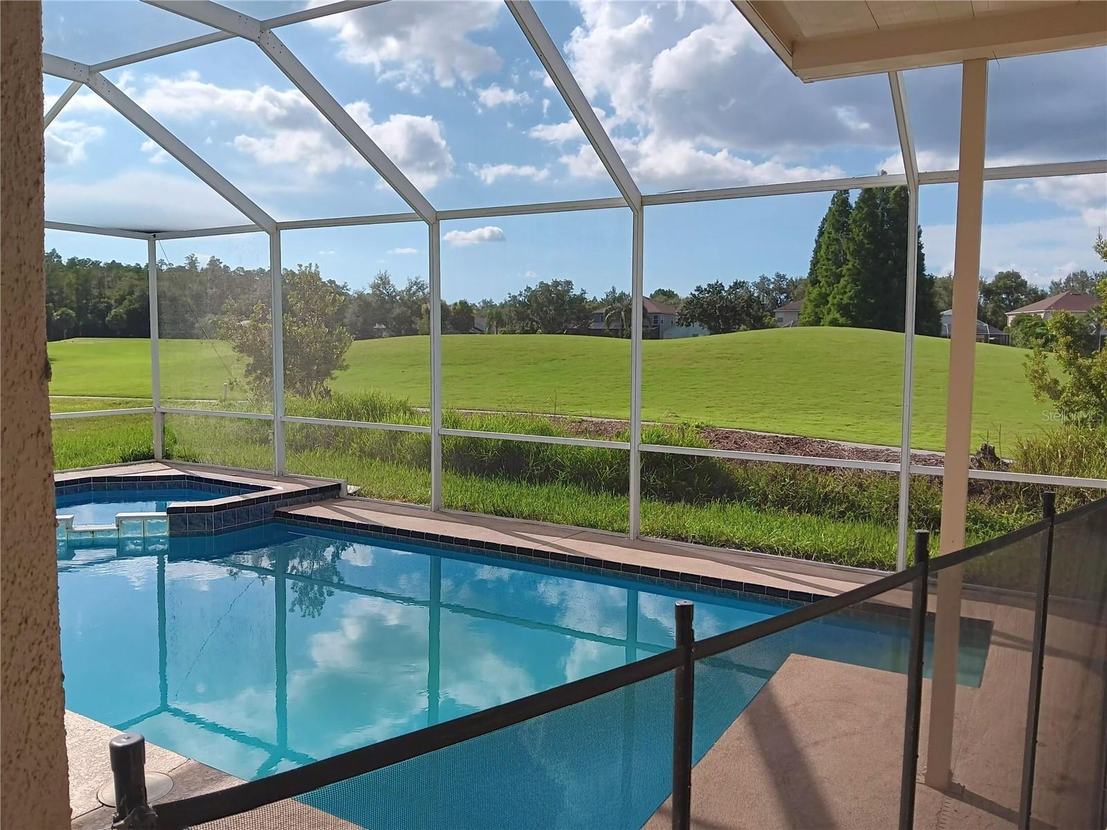 pool with spa on golf course