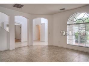 living rm with expensive travertine tiles