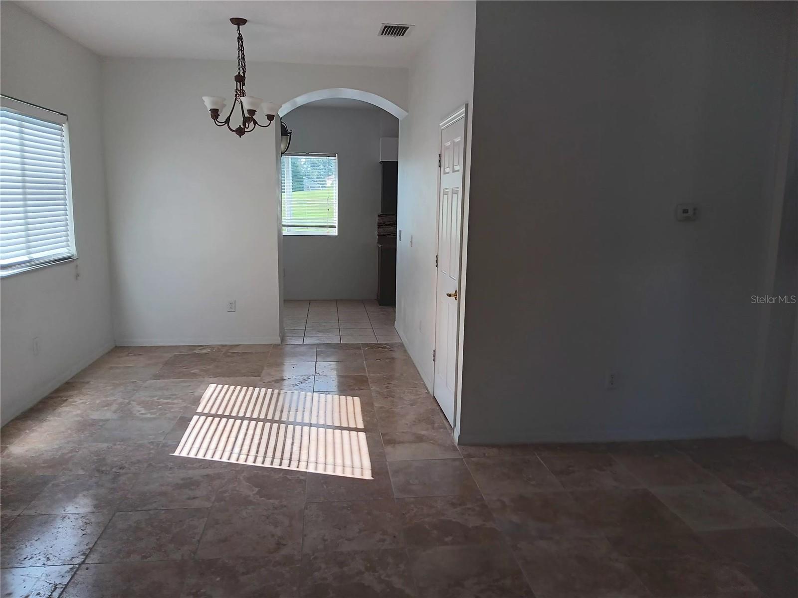 dinning rm with expensive travertine tiles