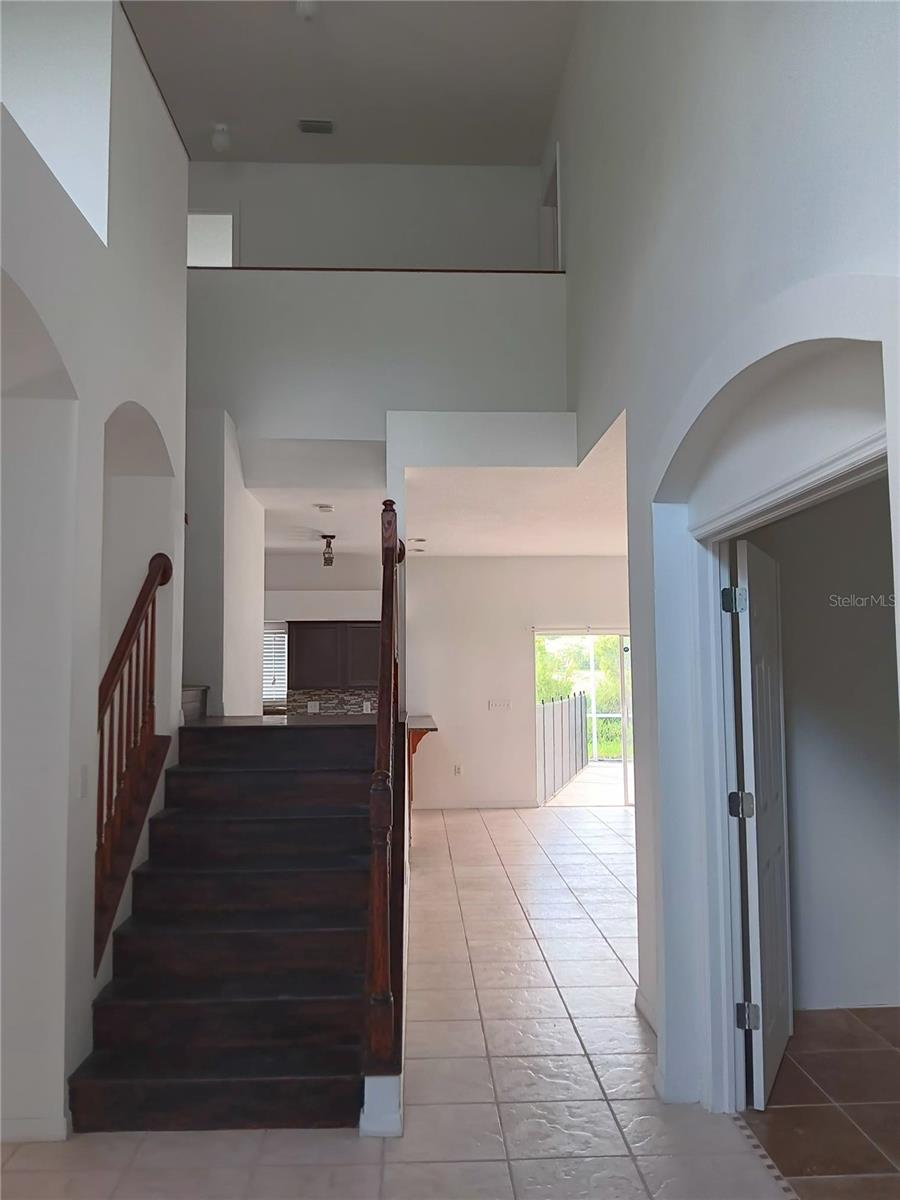 hallway to den, kitchen and upstairs