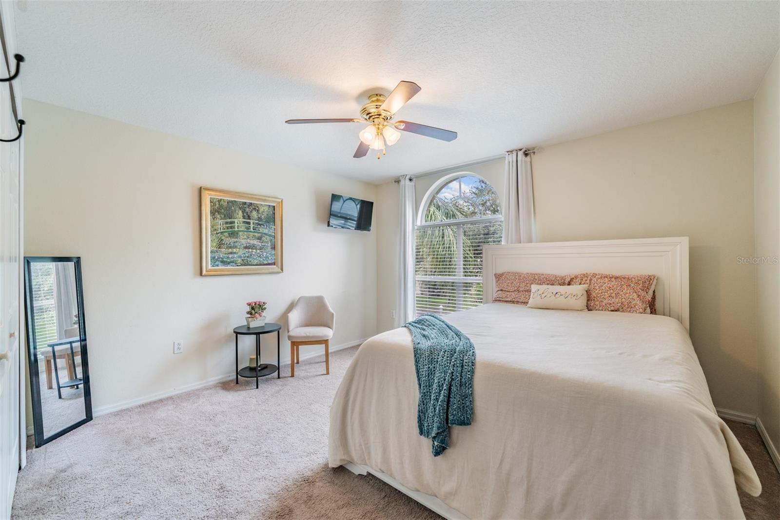 Guest Room with Ceiling Fan and light fixture.