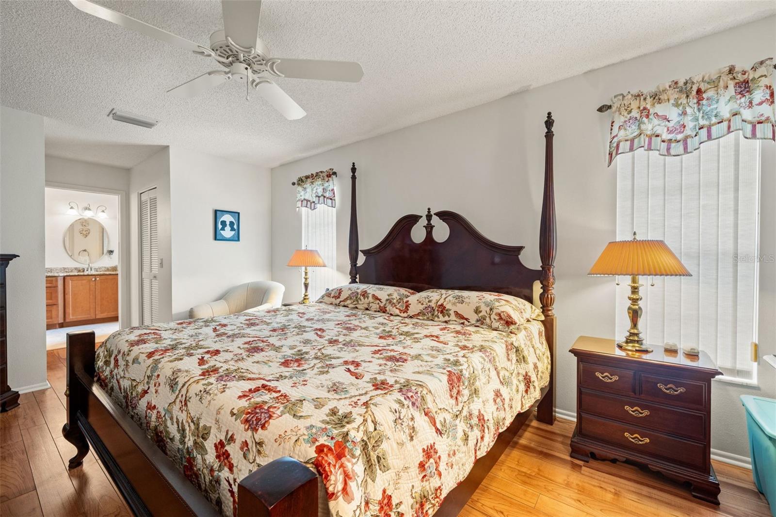 The light & bright Master Bedroom Suite with 2 walk-in closets, laminate flooring.