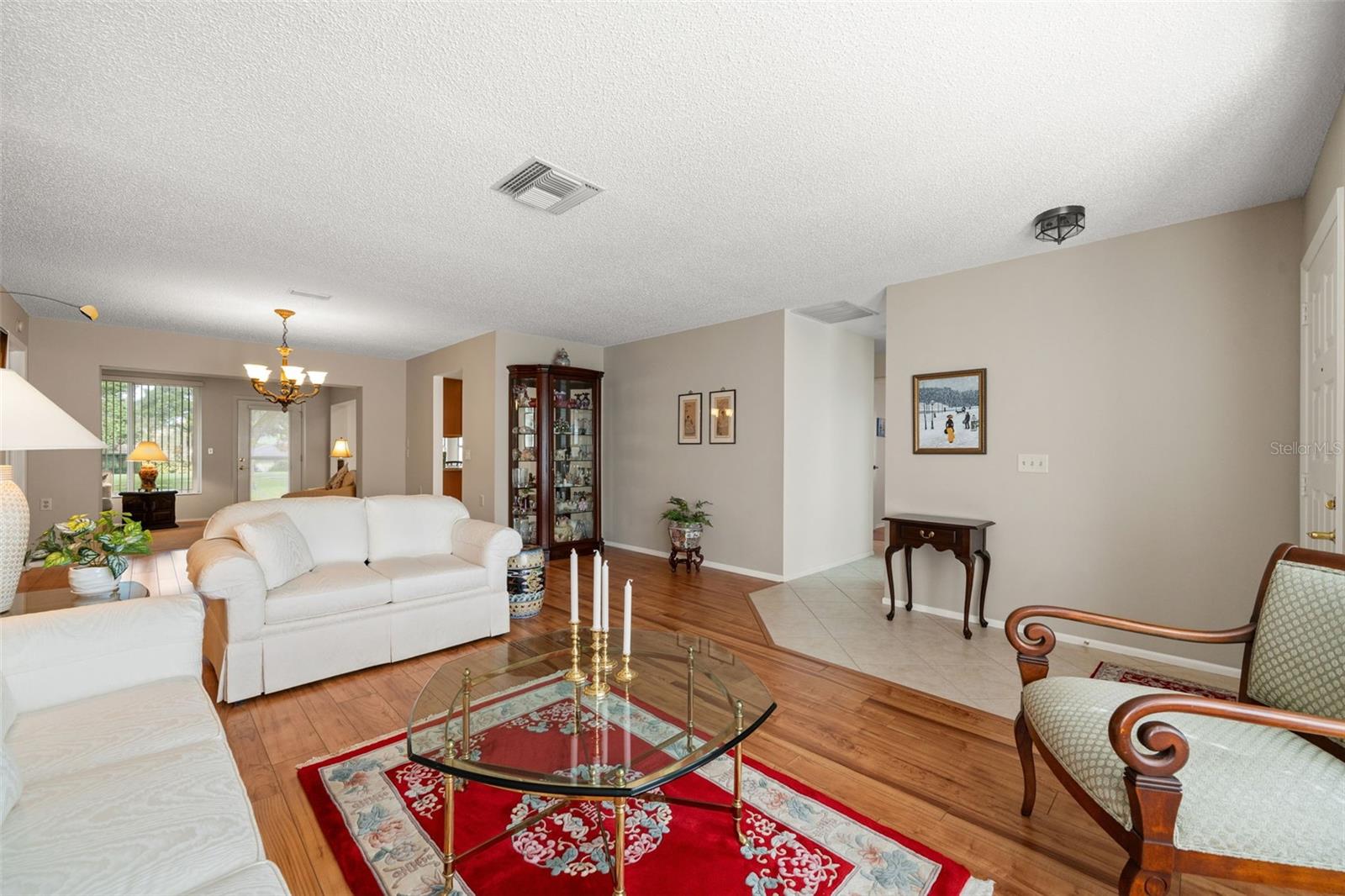 A combination Living rm-Dining rm runs from the front to back of the home/entrance to the Bonus room.