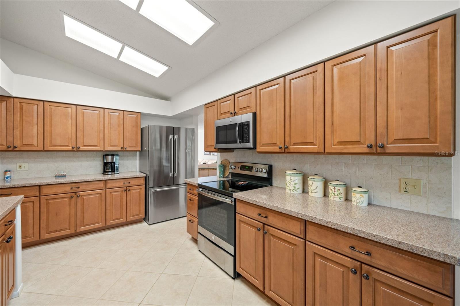 Such a spacious Kitchen! Lots of cabinets & Granite counter space.