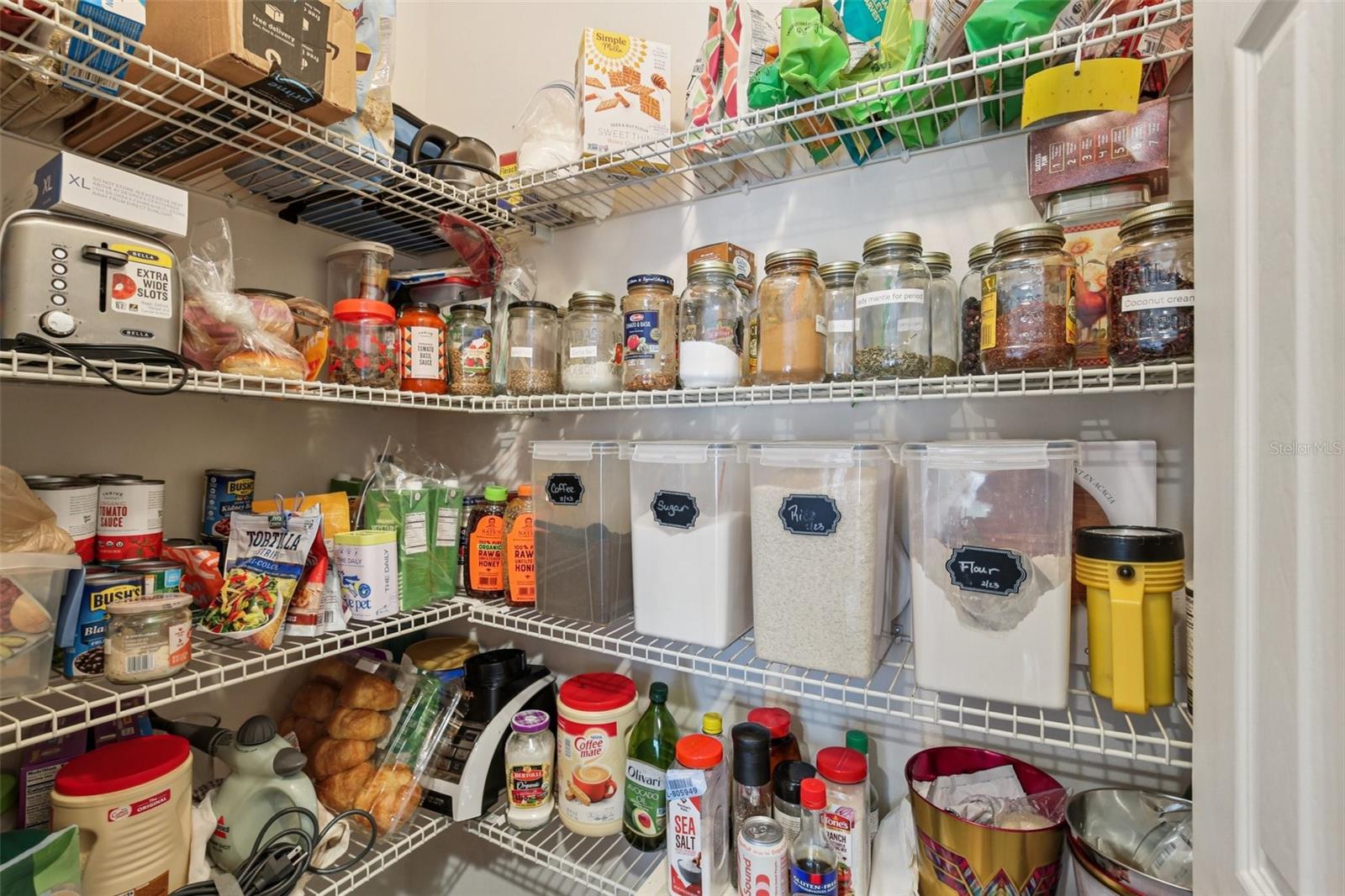 Kitchen Pantry between the oven and refrigerator.