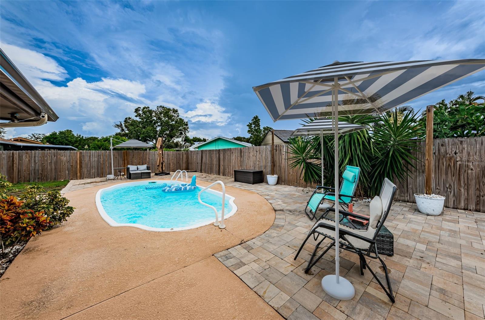 Backyard pool area-virtually staged