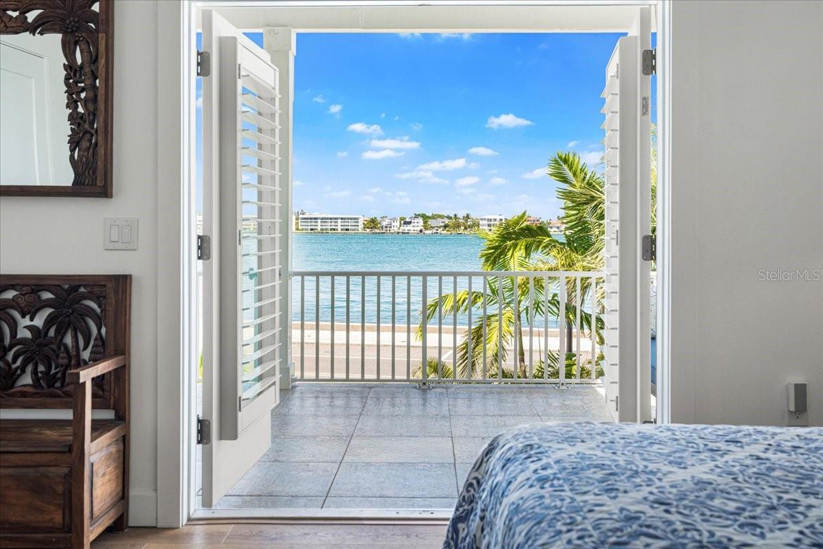 2nd Floor:  Primary Bedroom French Doors to Patio, sweeping water views