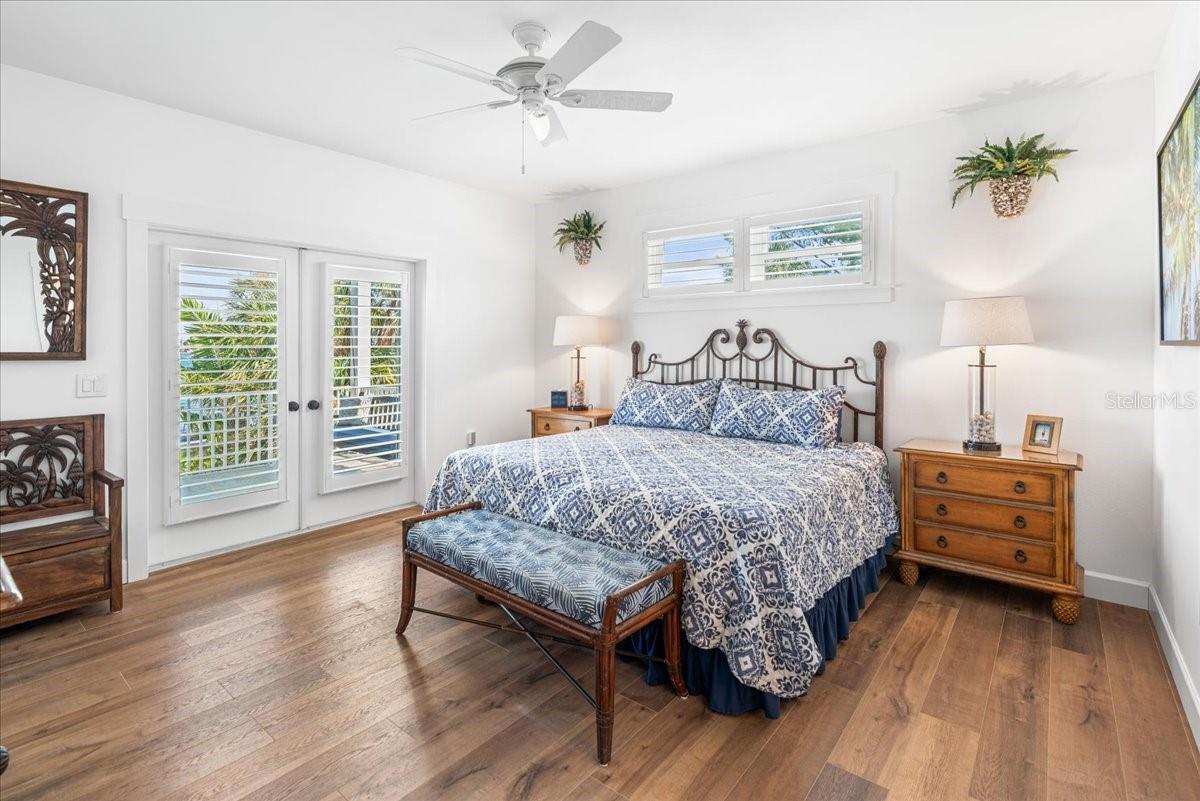 2nd Floor: Primary Bedroom, King Size Bed, Plantation Shutters, Ceiling Fan, French Doors to Patio