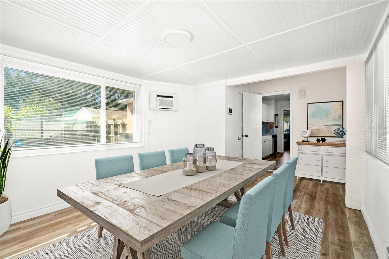 Virtually staged. A light-filled area provides a generous space for dining.