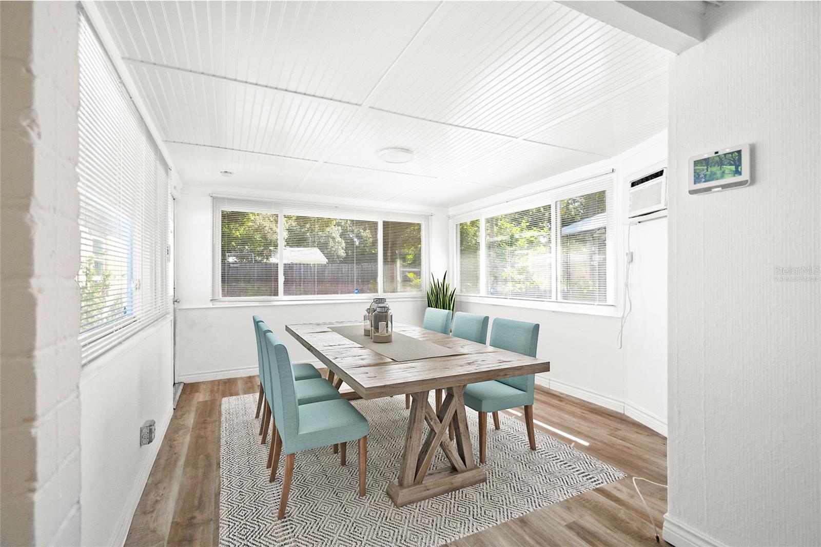 Virtually staged. Dining area with backyard access.