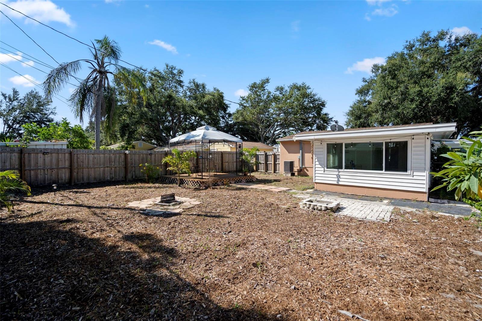 If a lock-and-leave lifestyle is desirable the mulched yard makes for easy home maintenance.  Plenty of room to add a pool.