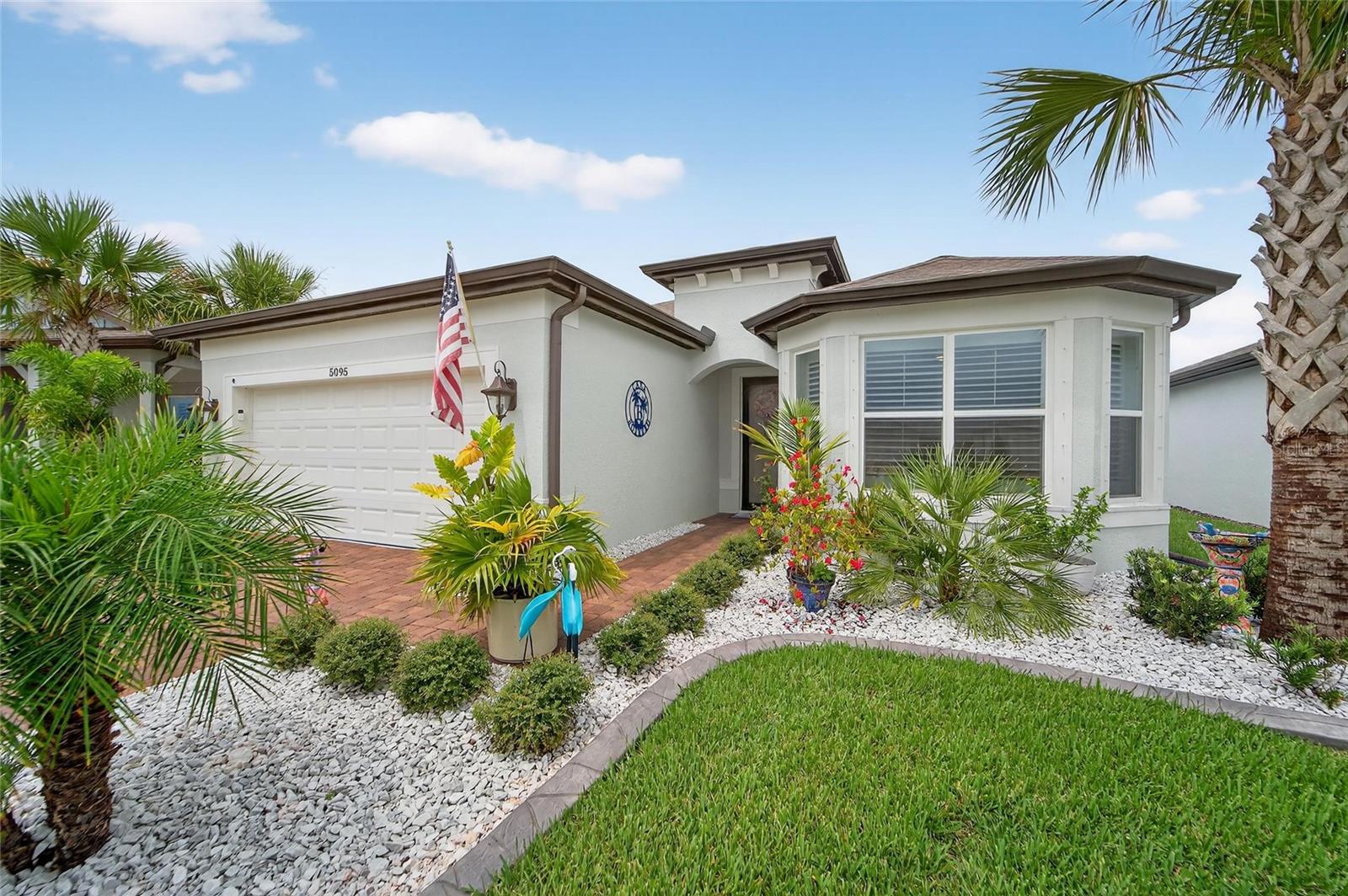 Front of home with upgraded landscaping