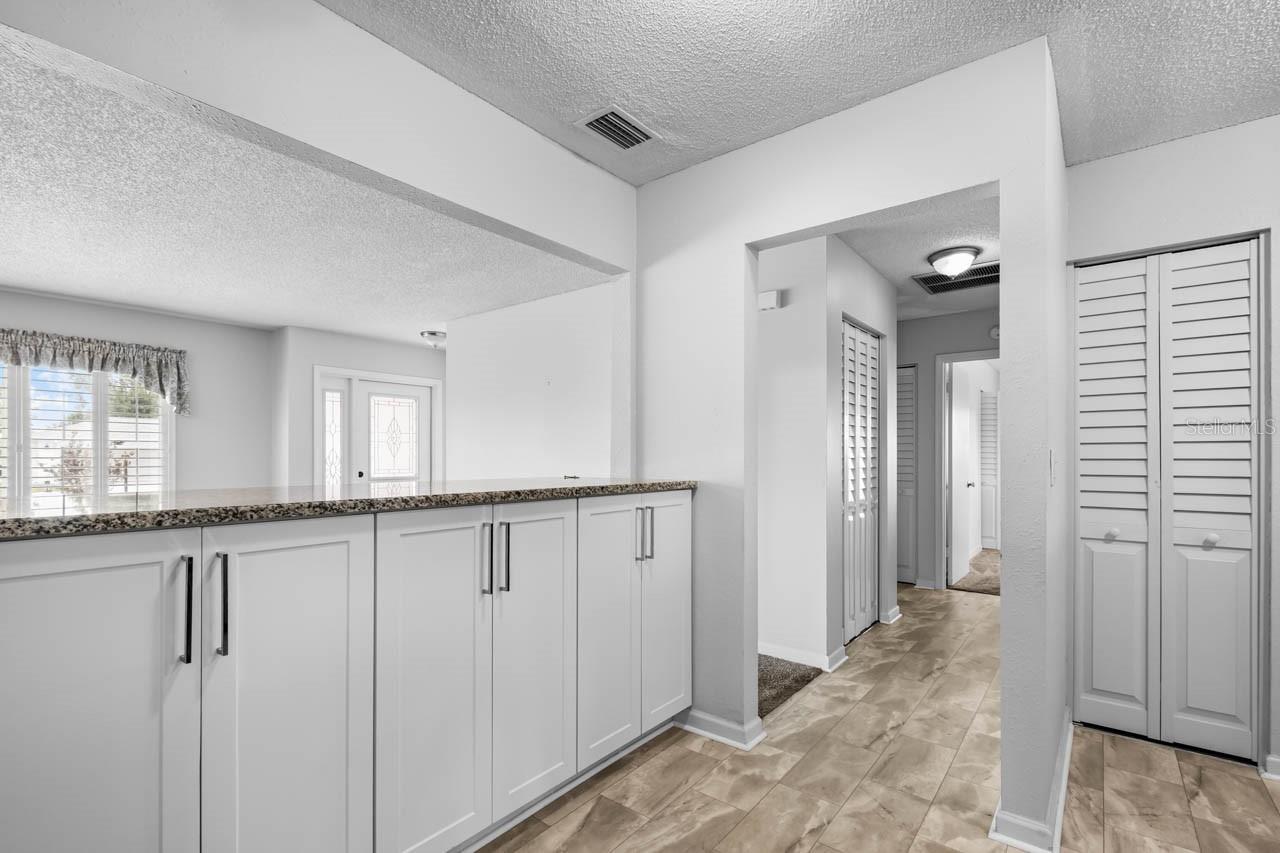 Extra storage under the bar. Facing the hallway to the Primary