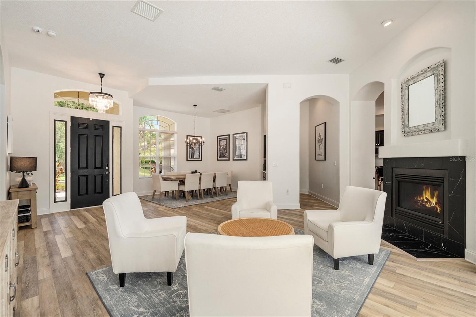 Living Room into Dining Room and Wet Bar