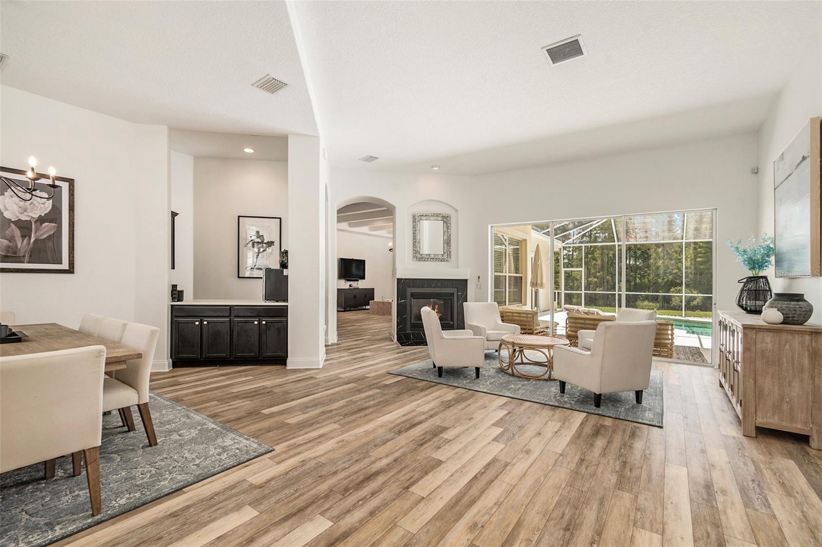 Upon entry you see the Dining Room, Wet Bar, Living Room, and Pool!