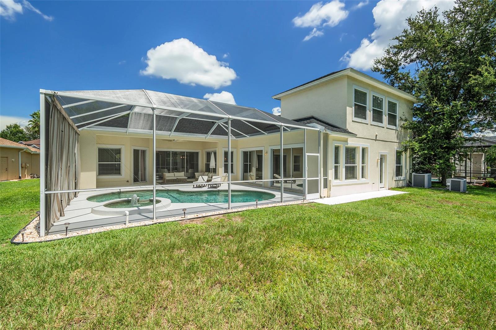 Pool with Four Entries and Views from House Fully Caged to Keep Bugs Out