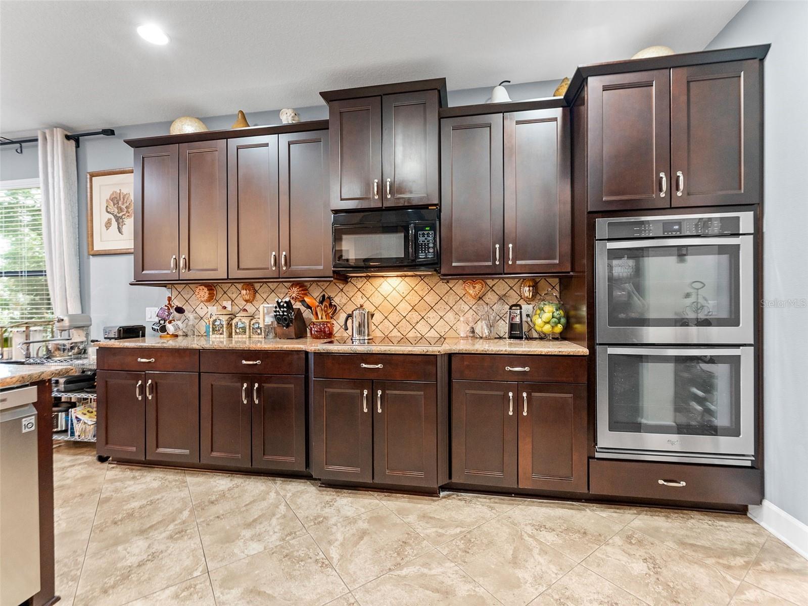 Espresso cabinetry with custom pullout drawers and shelving