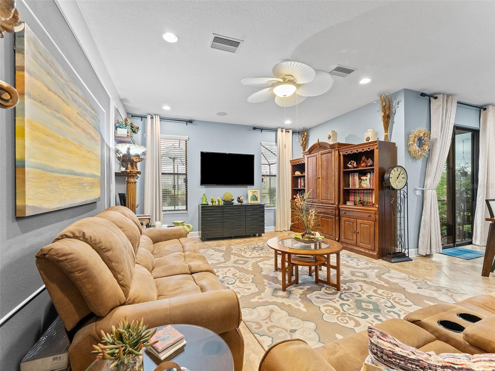 Family room with tall ceilings and custom washable draperies.