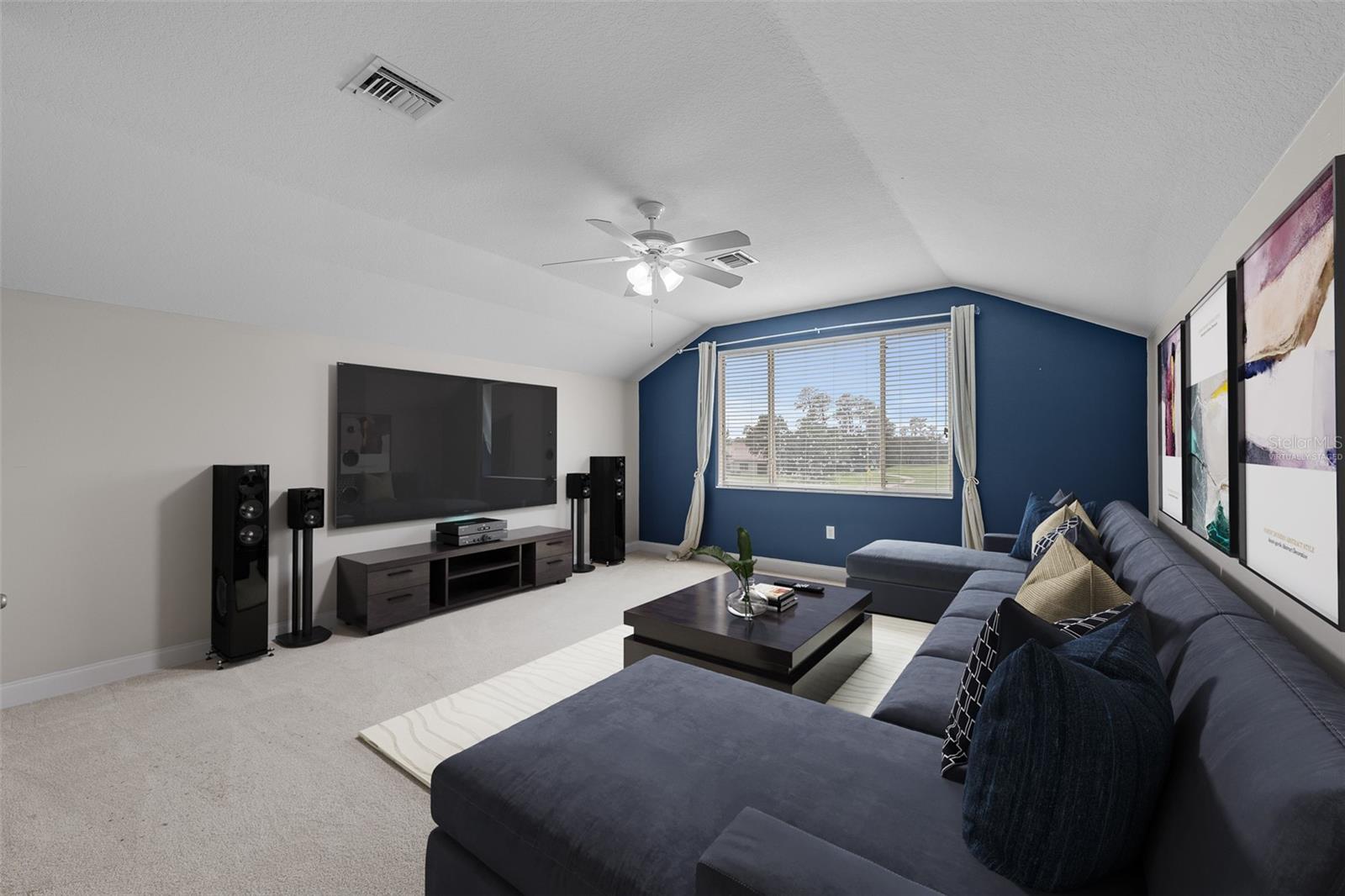Second floor Media Room Loft space has closet and bathroom and could be used as additional bedroom.  Has been virtually staged.