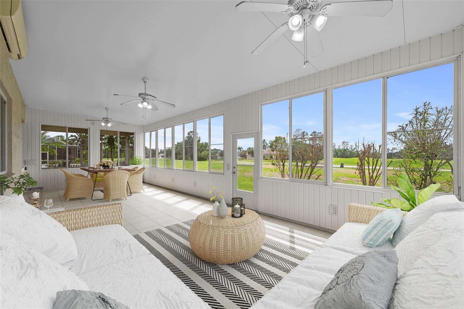 Additional Florida room overlooking the golf course has bathroom, AC and fans.  Has been virtually staged.
