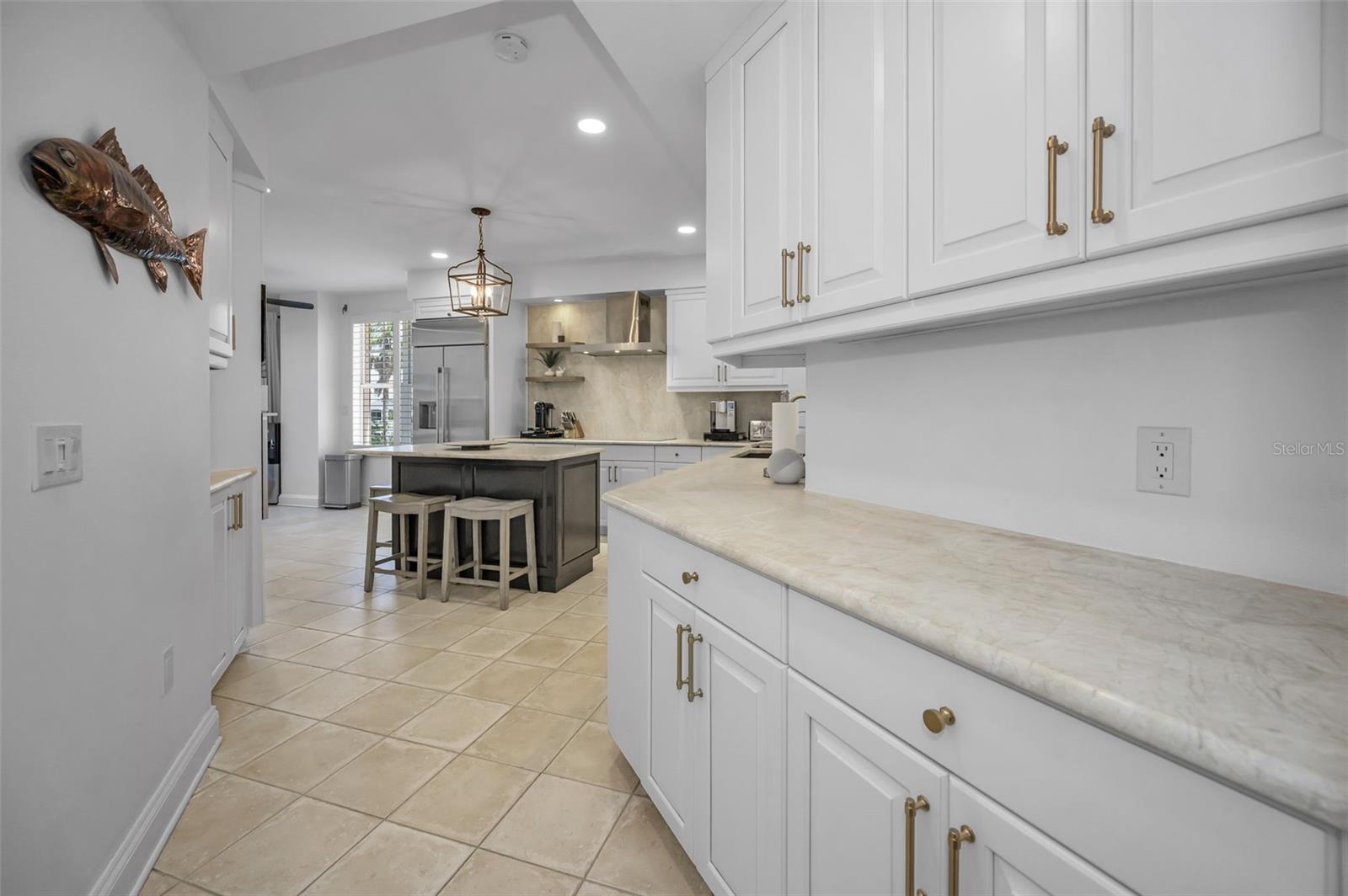 Entry way to the kitchen offers more counters and storage.