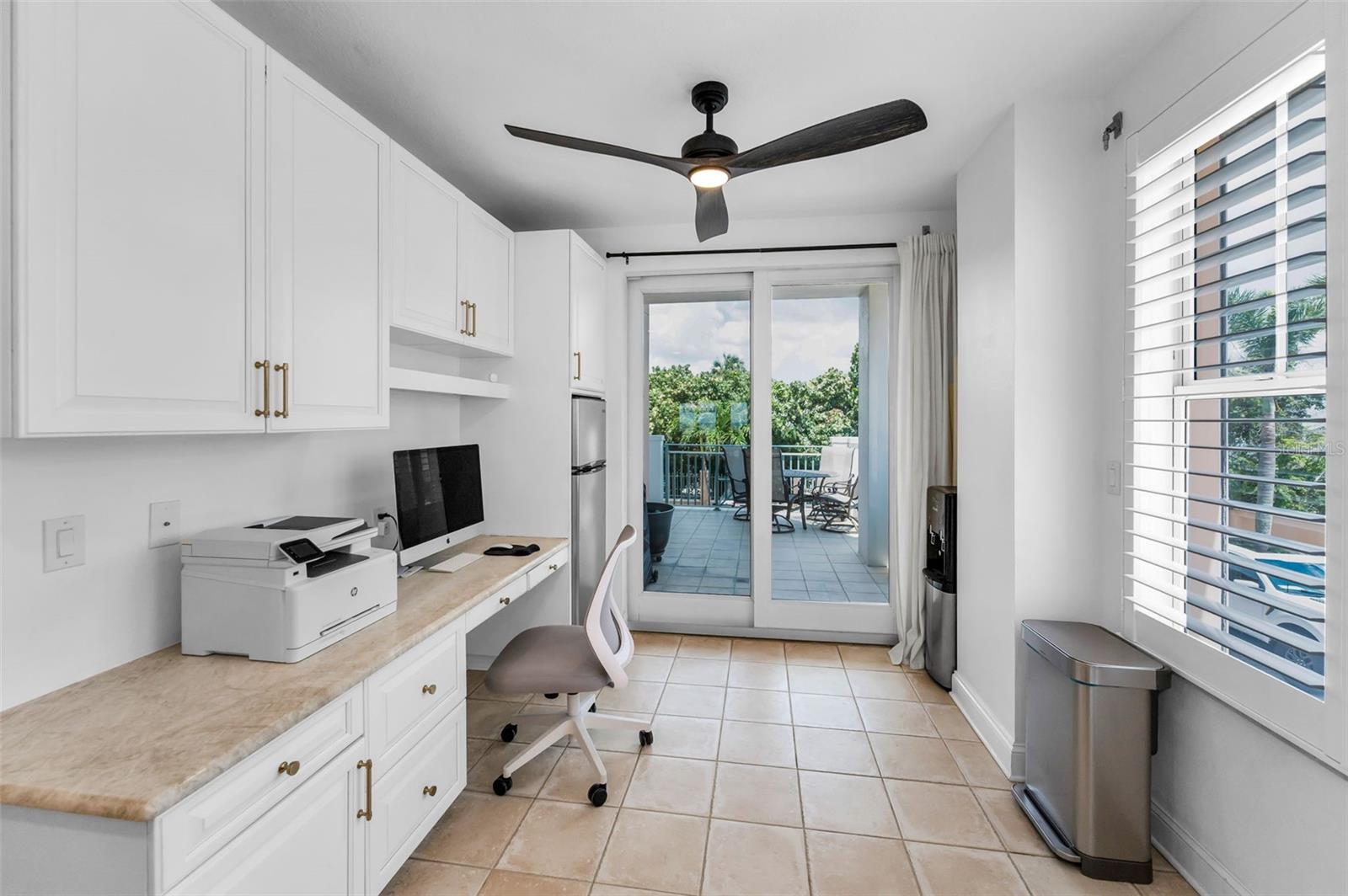 The kitchen also has a additional office space tucked in the back.