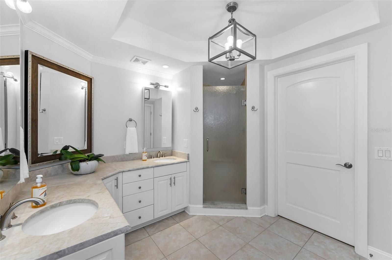 Primary Ensuite 1 - Double corner vanity offers plenty of space for sharing.