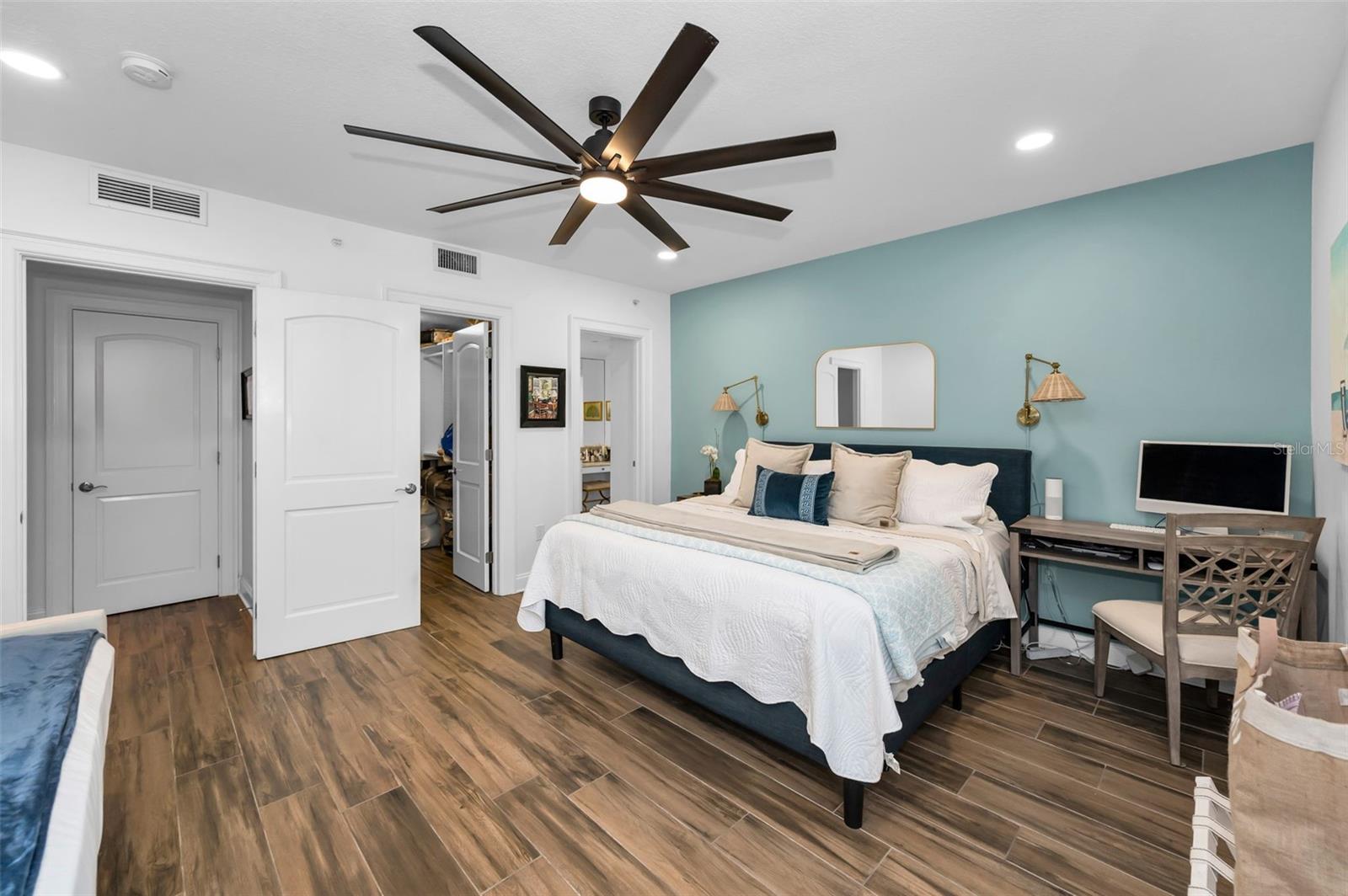 Guest Suite - boasts a private ensuite, walk-in closet, balcony, and plenty of space.