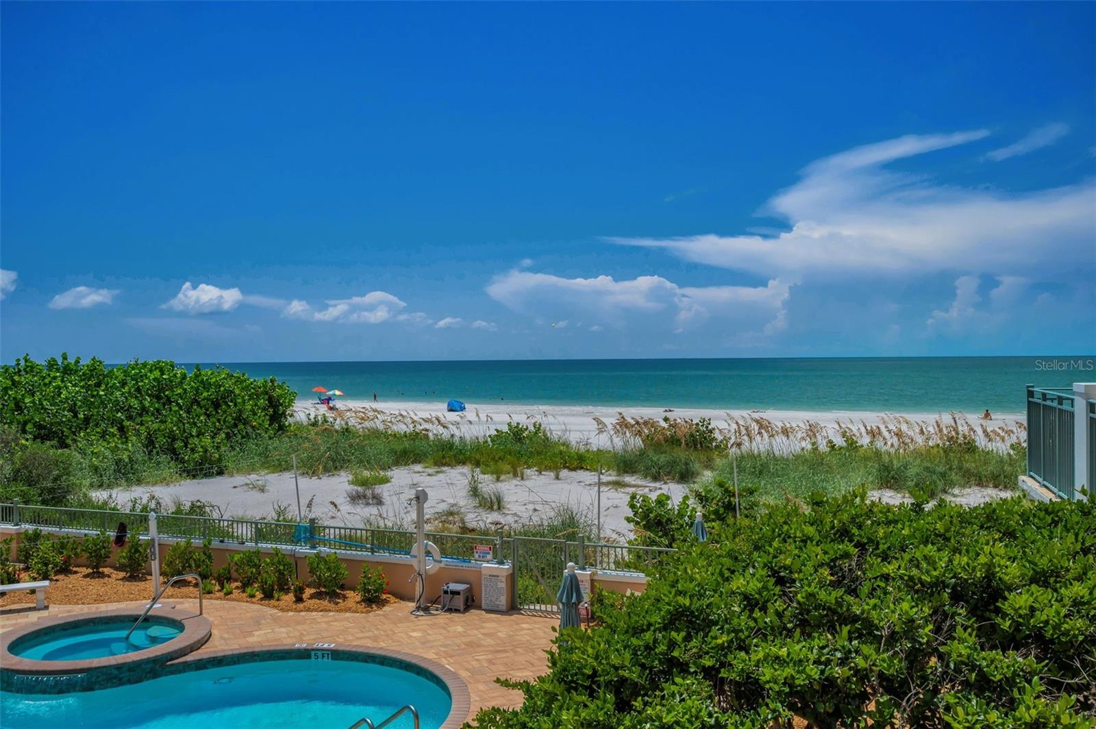 Beachfront pool area - Residents can access the beach through the secure gate.