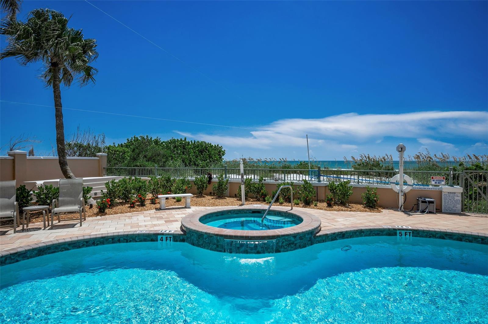 Beachfront pool area - Take a dip in the hot tub.