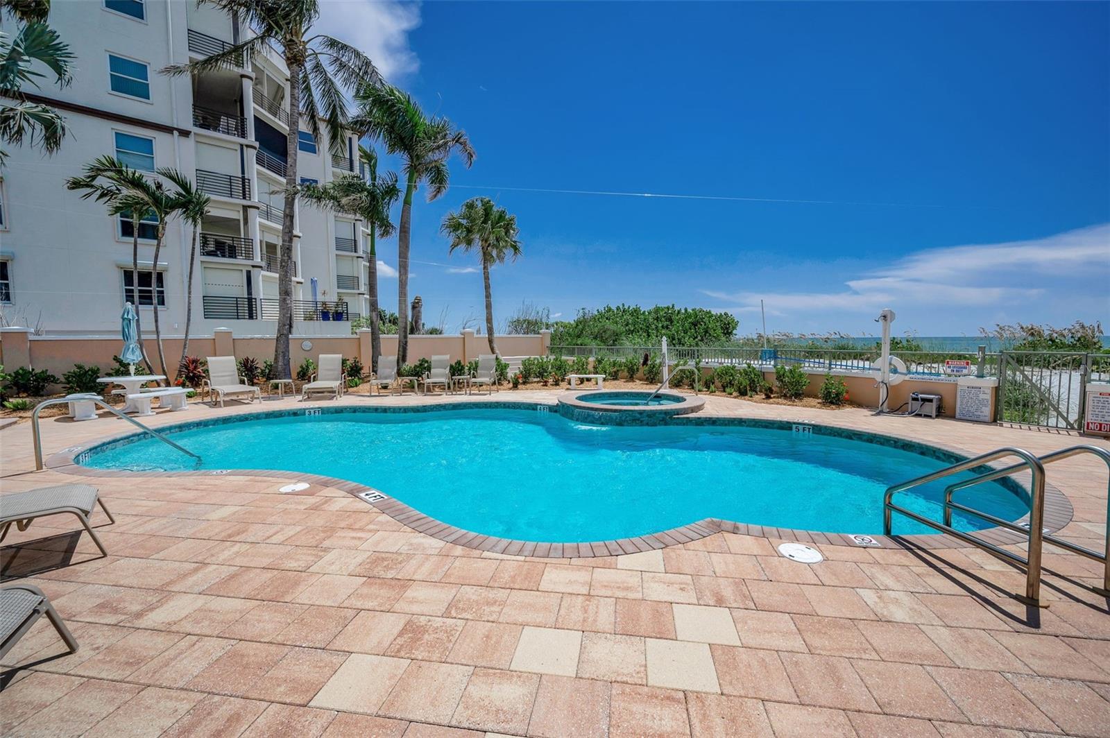Beachfront pool area -Perfect for relaxing all day.