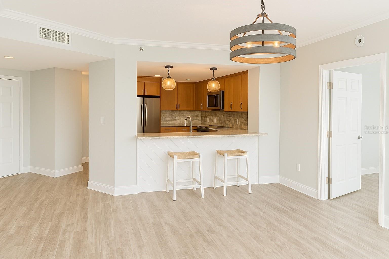 Spacious kitchen with bar (Virtually Staged)