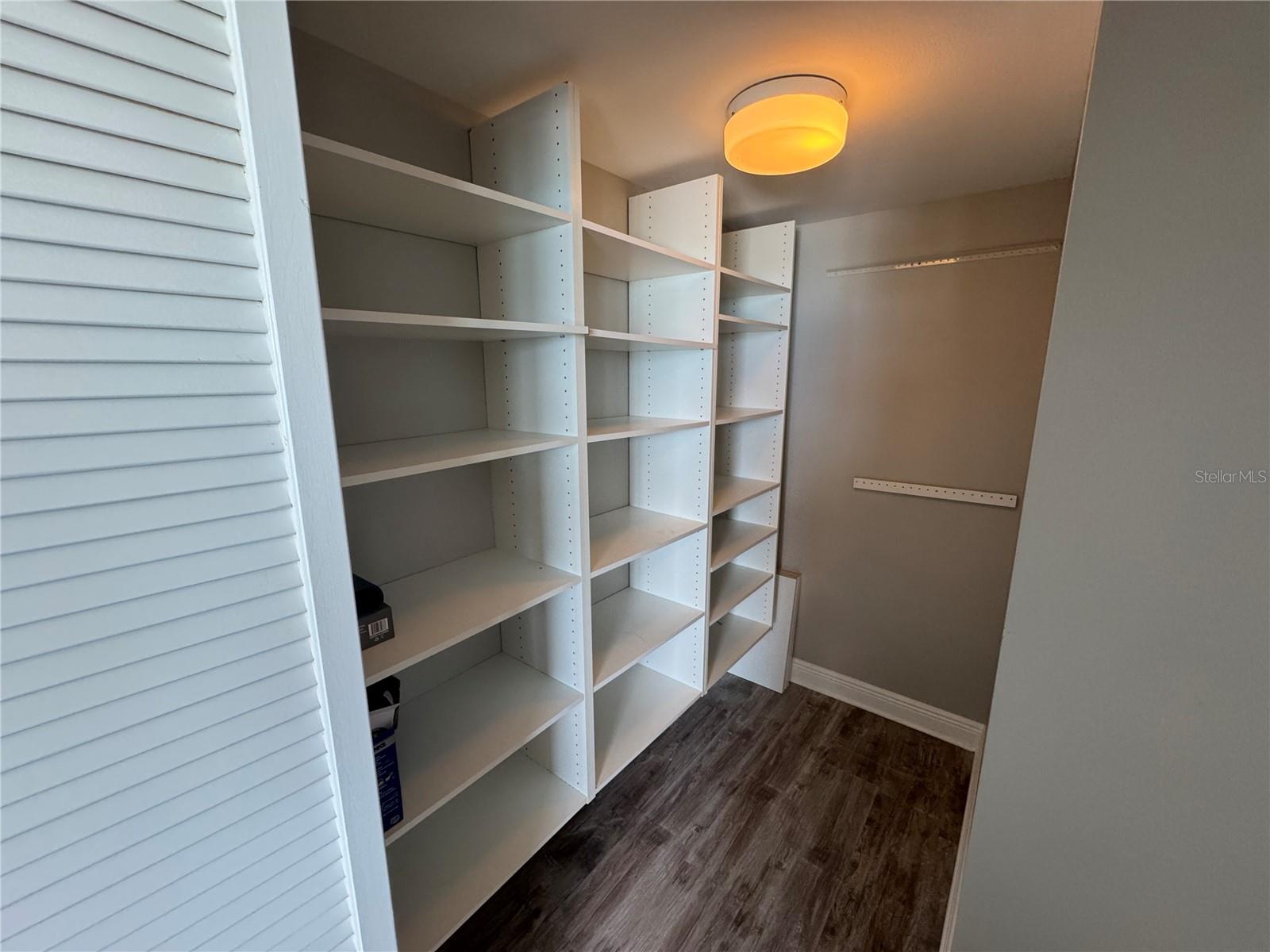 2nd bedroom walk in closet with closet system!
