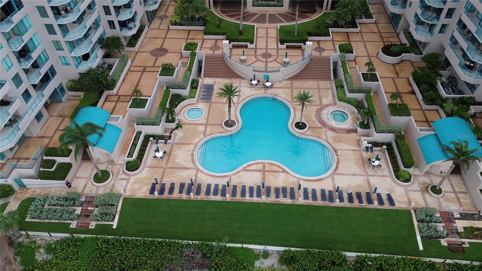 "Mickey" pool, kiddie pool, and hot tub, with plenty of lounges and seating!