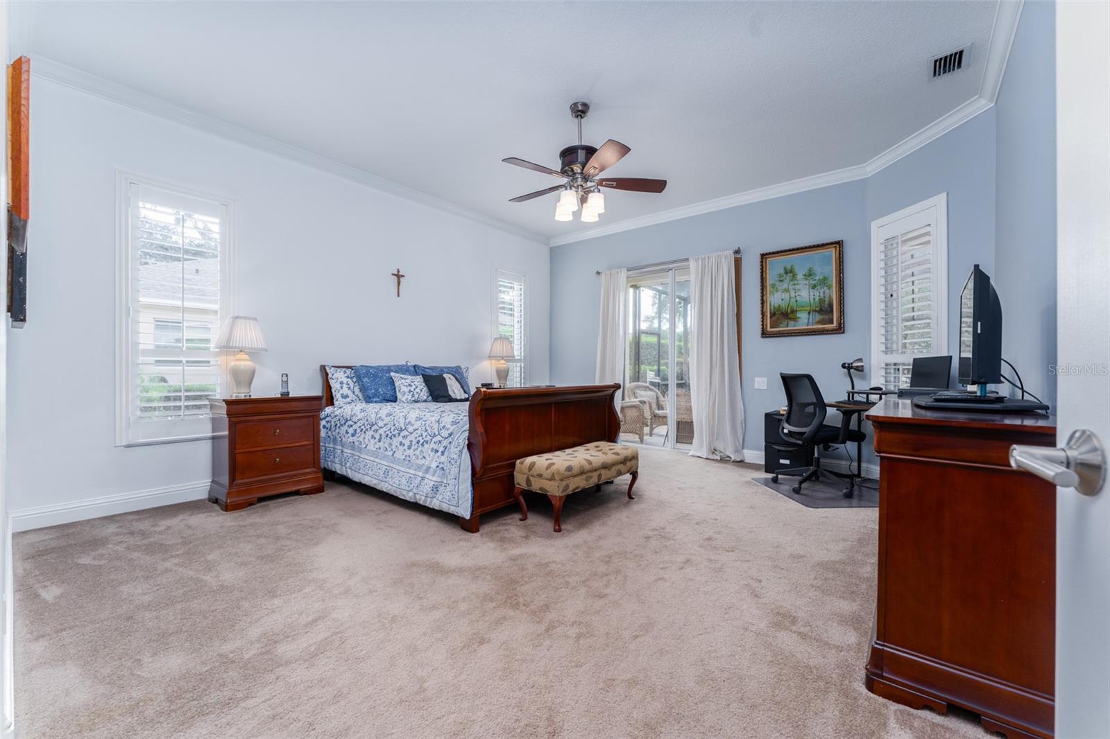 Spacious Primary Suite with Sliders that lead to Outdoor Living Space