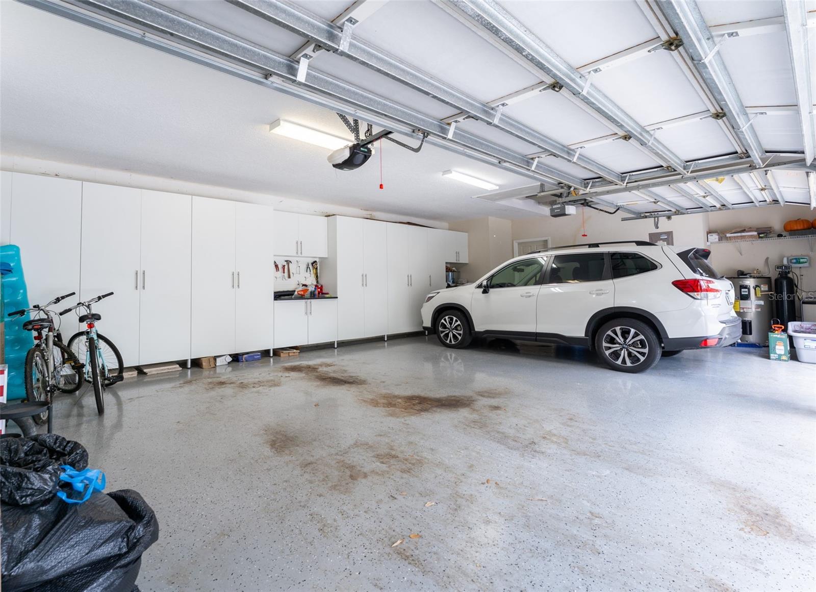Garage with New Built in Shelving Along the Entire Back Wall