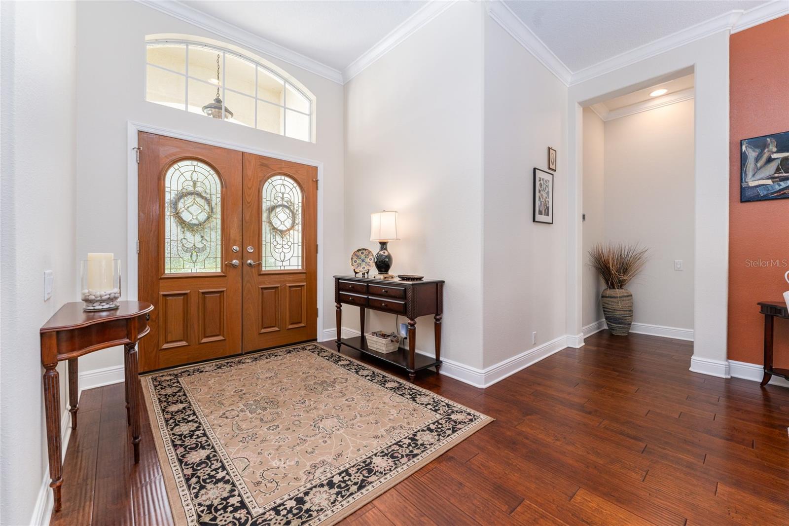Foyer with Double Wood Doors with Glass Insets