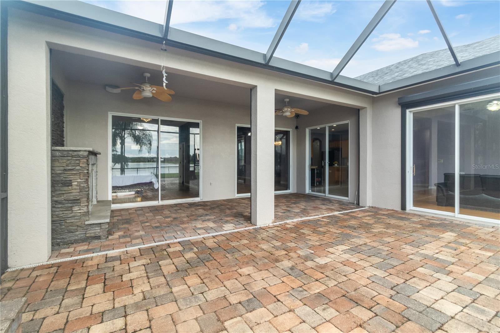 screen in lanai with outdoor gas fireplace