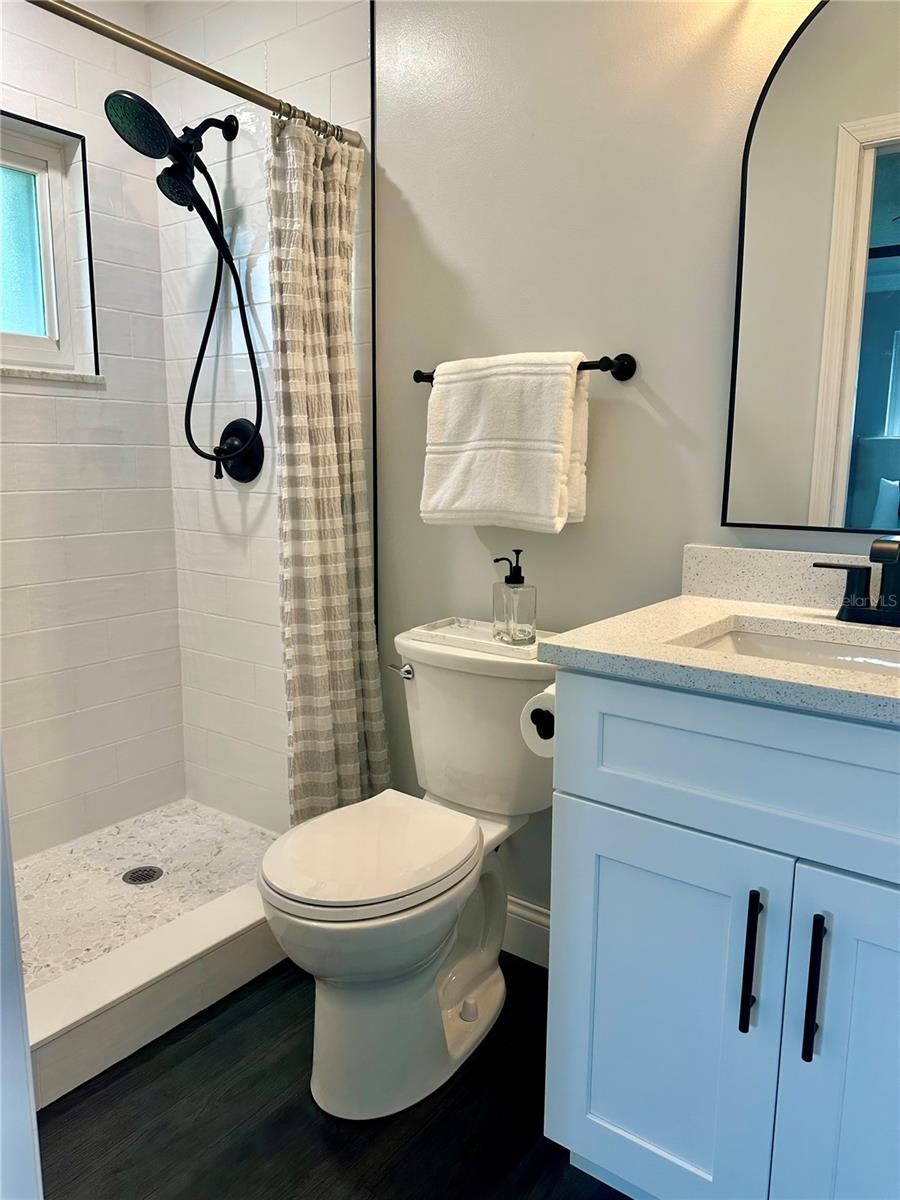 Primary ensuite bathroom with step-in shower.