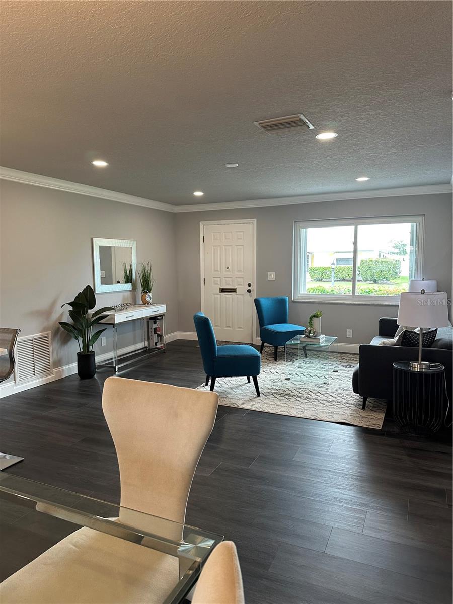 From the dining space looking to front entrance and living room.