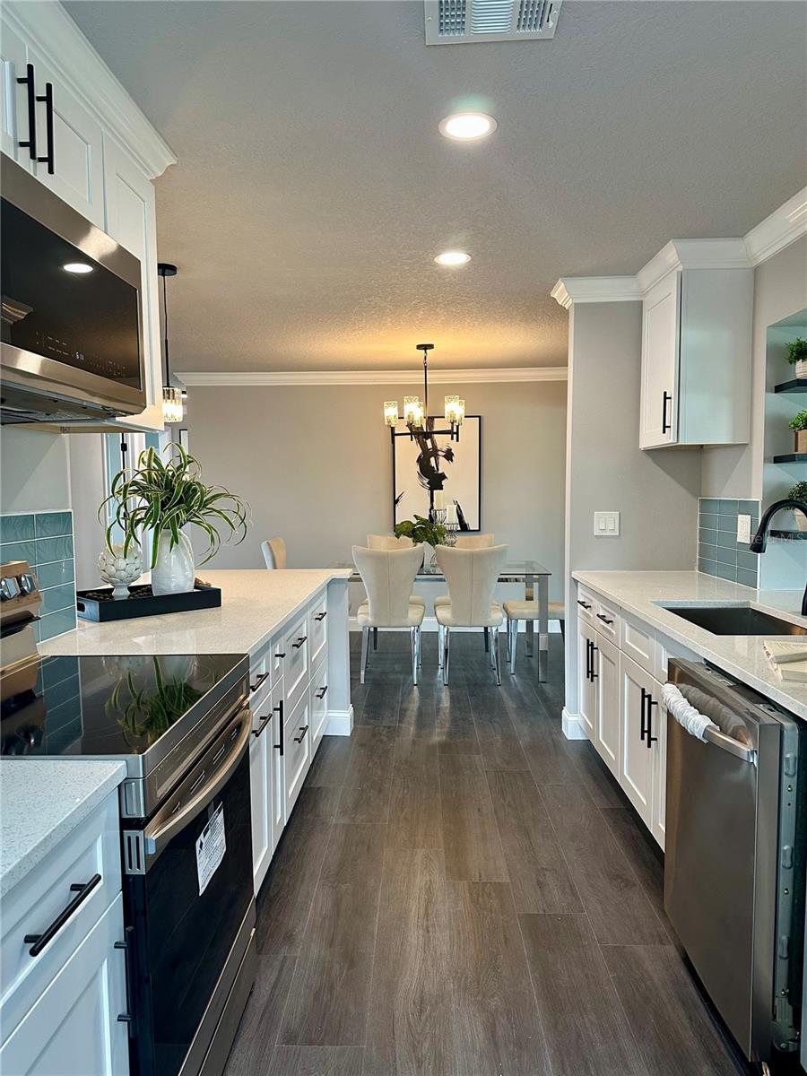 Kitchen and Dining space with luxury vinyl plank flooring.